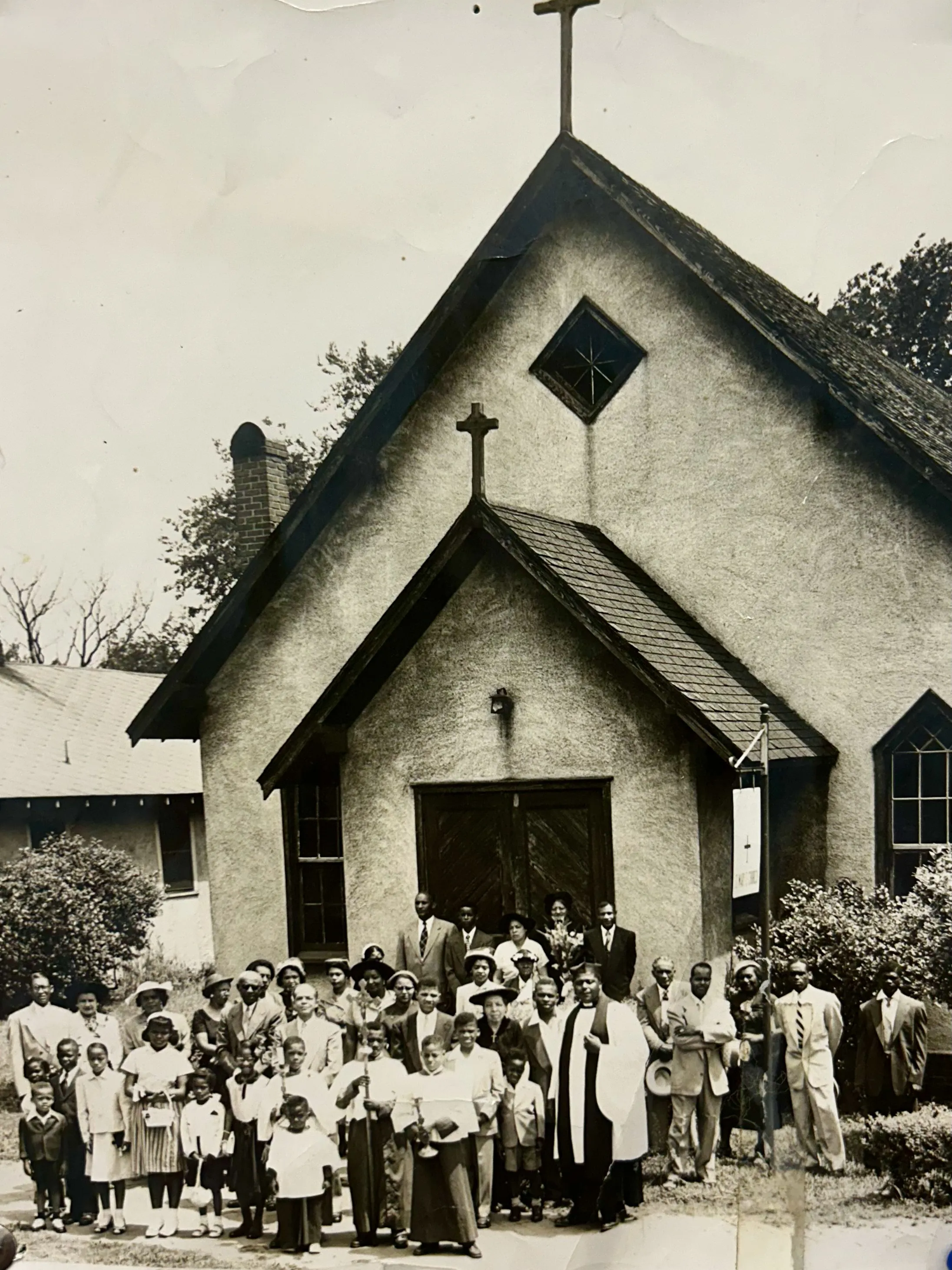 Historic group photo of St. Mary the Virgin Episcopal Church congregation gathered at the church entrance